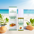 Canon's Turmeric Serum packaging on a beach with shells and plants